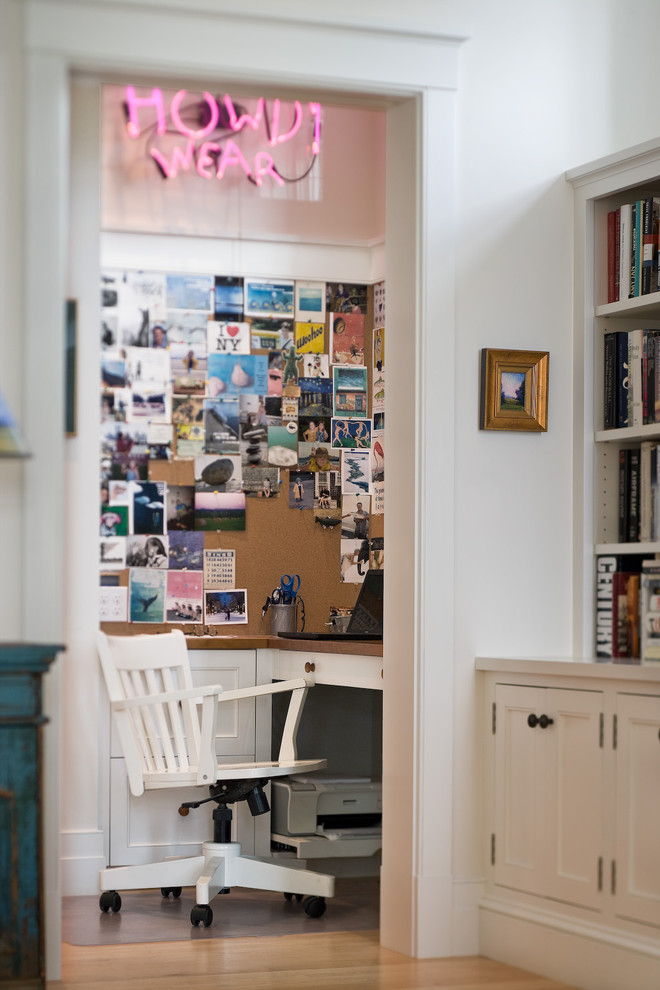 Small elegant built-in desk light wood floor home office photo in Burlington with white walls