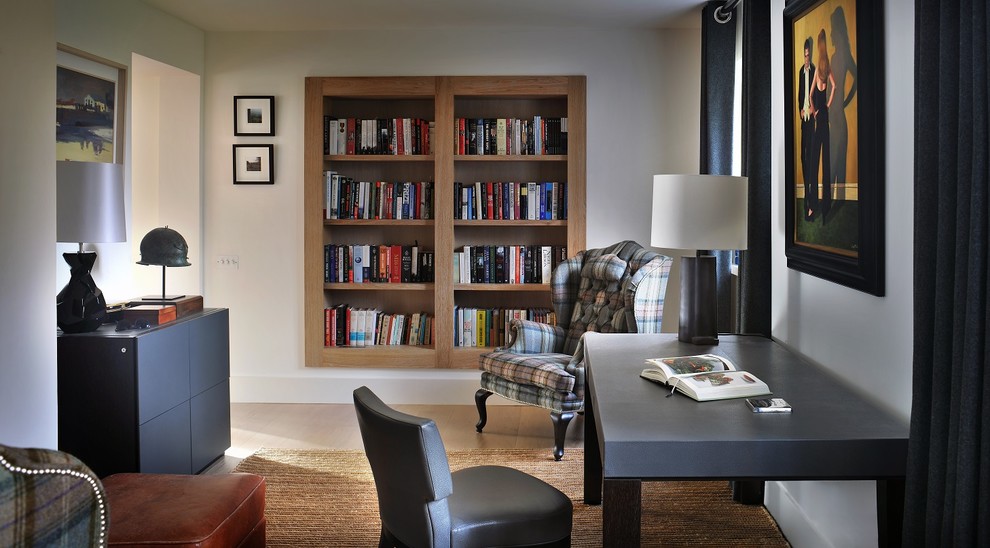 This is an example of a medium sized classic study in Surrey with grey walls, a freestanding desk and beige floors.