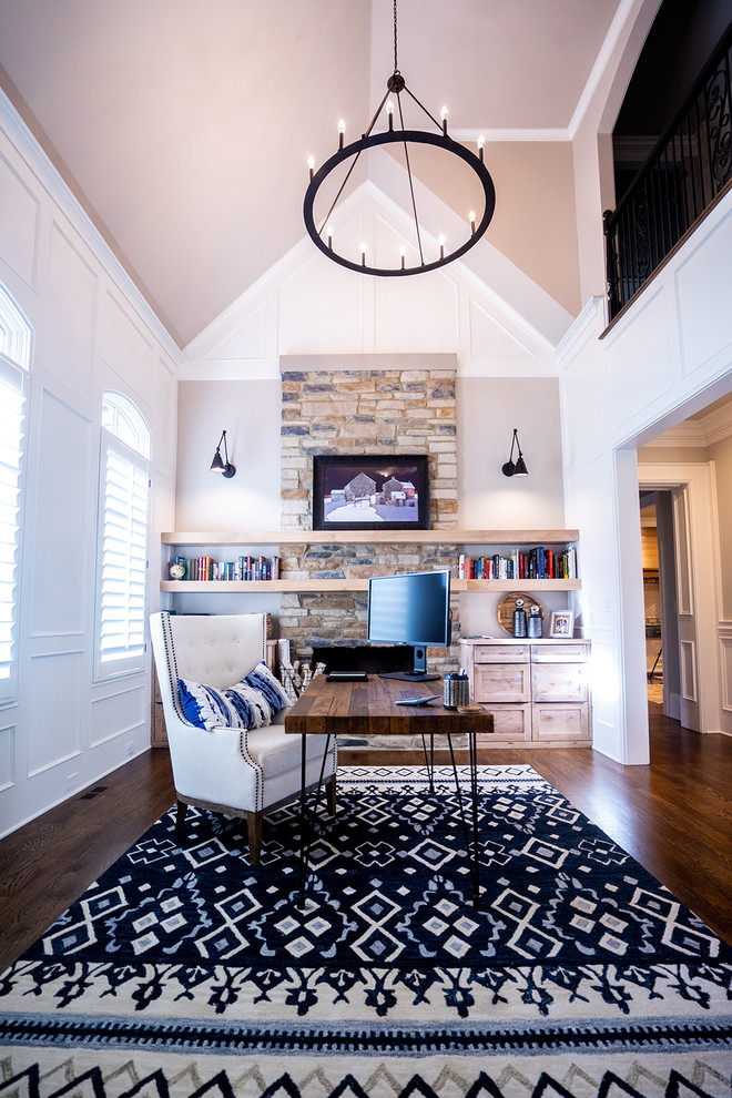 Mid-sized transitional freestanding desk light wood floor and brown floor home studio photo in Atlanta with gray walls, a standard fireplace and a stone fireplace