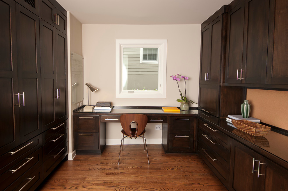 Example of an arts and crafts built-in desk home office design in Austin