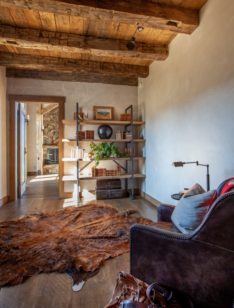 Photo of a medium sized rustic study in Denver with white walls, dark hardwood flooring and brown floors.