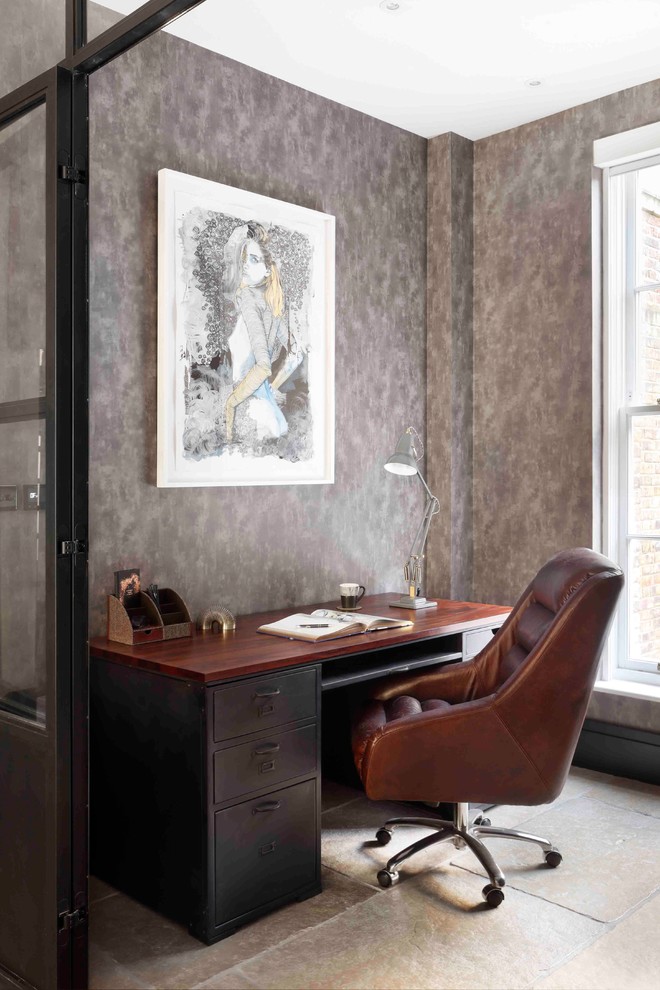 Photo of a small contemporary study in London with grey walls, a freestanding desk and grey floors.