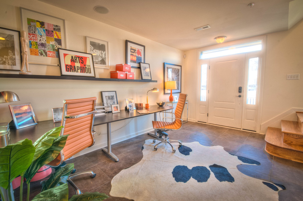 Inspiration for a contemporary freestanding desk home office remodel in DC Metro with white walls