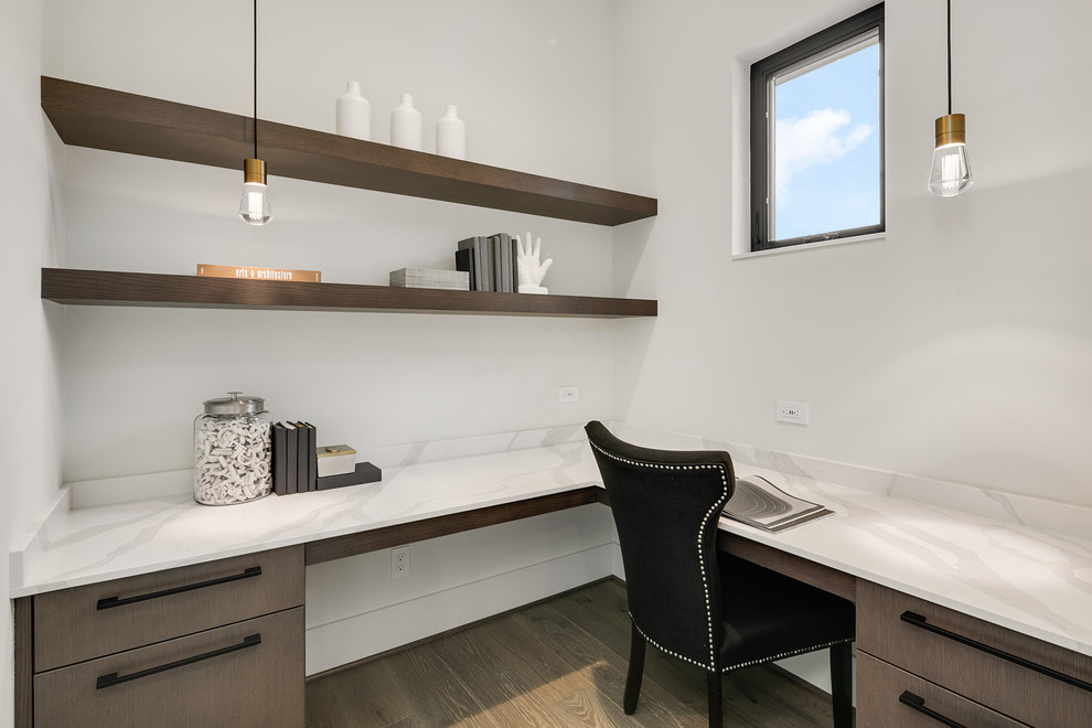 Inspiration for a mid-sized contemporary built-in desk medium tone wood floor and gray floor study room remodel in Seattle with white walls