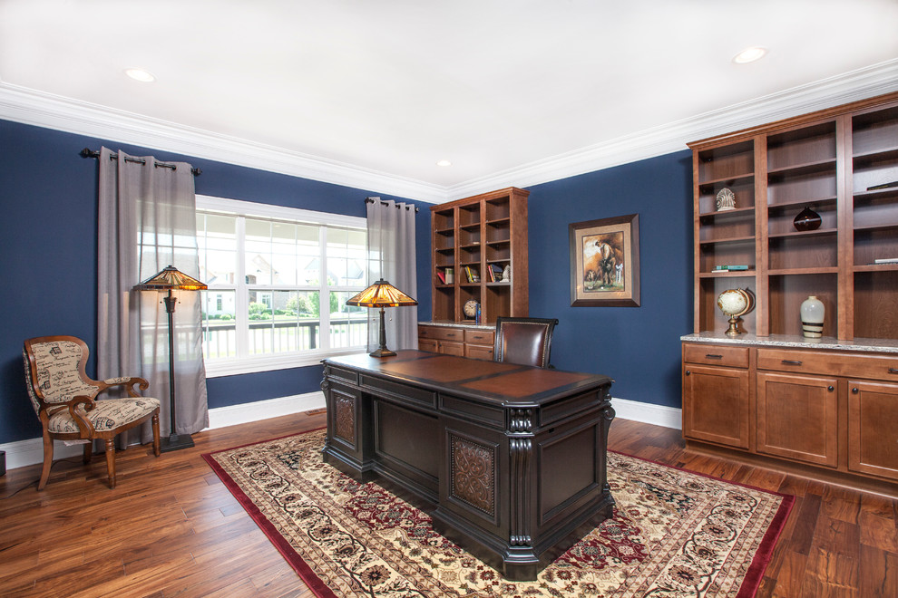 Design ideas for a classic study in Chicago with blue walls, medium hardwood flooring and a freestanding desk.