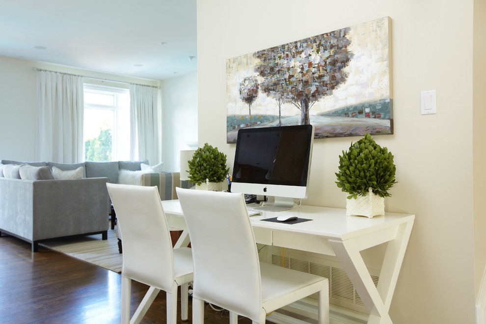 Home office - mid-sized traditional freestanding desk dark wood floor and brown floor home office idea in Toronto with beige walls