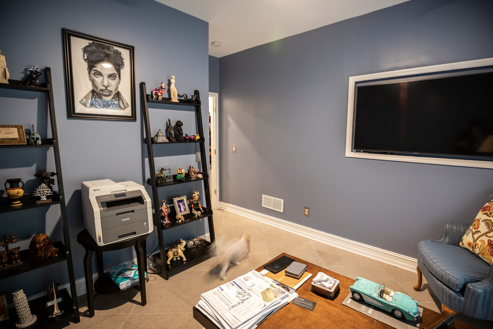 This is an example of a medium sized classic study in Atlanta with blue walls, porcelain flooring, no fireplace, a freestanding desk and beige floors.