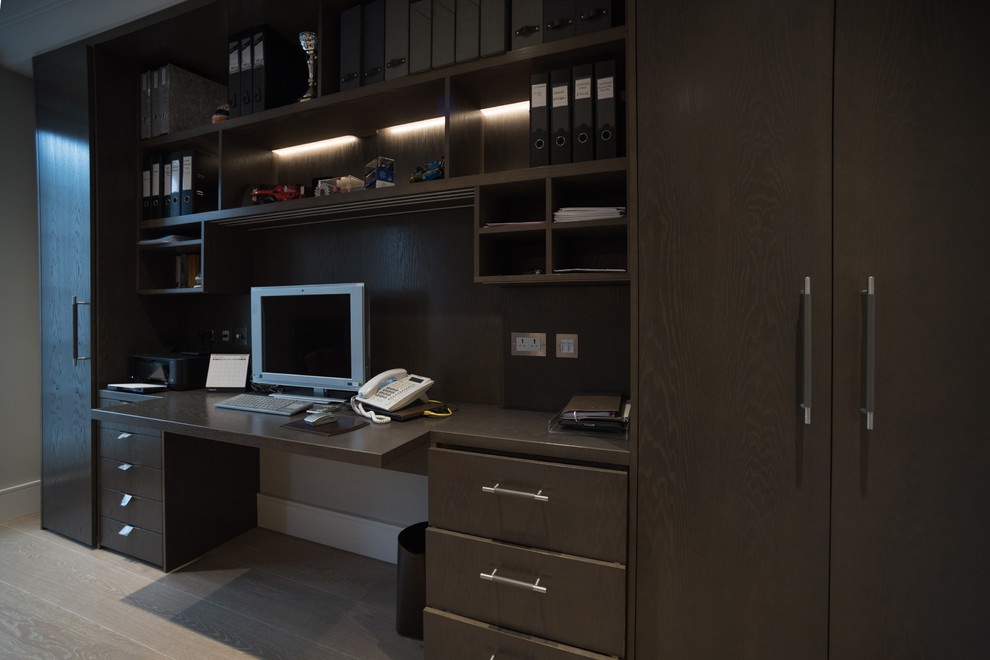Contemporary home office in London with grey walls.