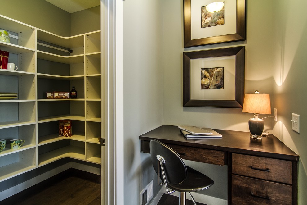 Inspiration for a mid-sized transitional freestanding desk dark wood floor study room remodel in Minneapolis with gray walls and no fireplace