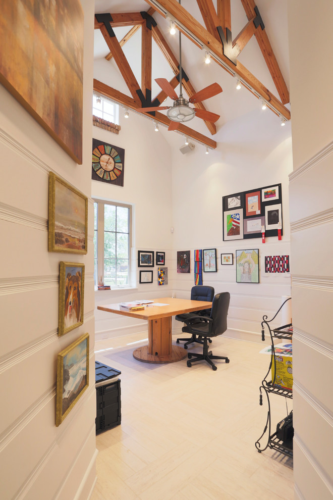 Contemporary home office in Houston with white walls and a freestanding desk.