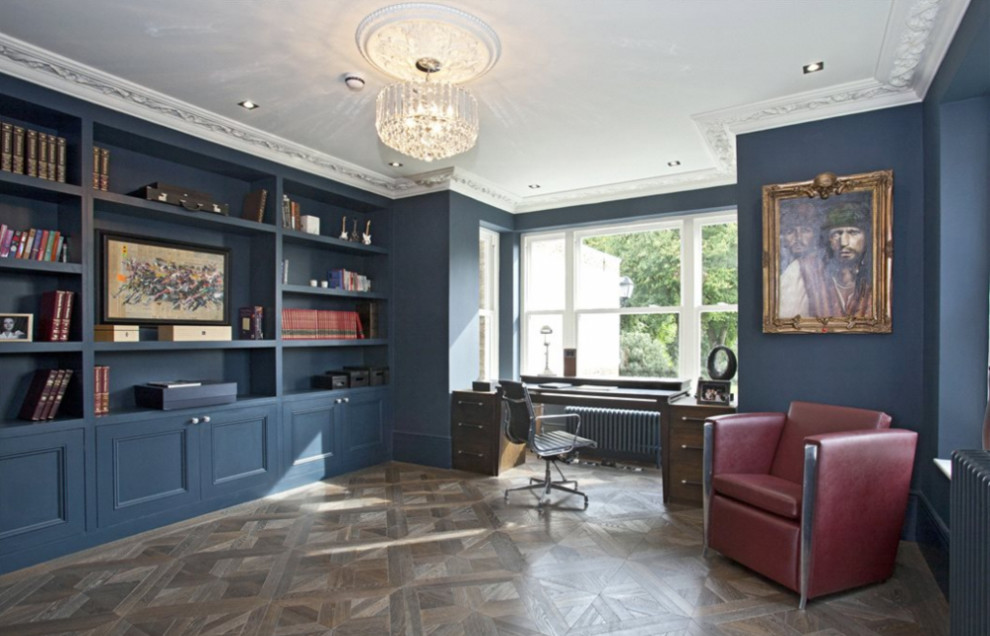 Example of a large trendy freestanding desk medium tone wood floor study room design in London with blue walls and no fireplace
