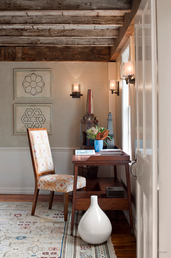 Example of a mid-sized trendy freestanding desk dark wood floor study room design in Boston with gray walls