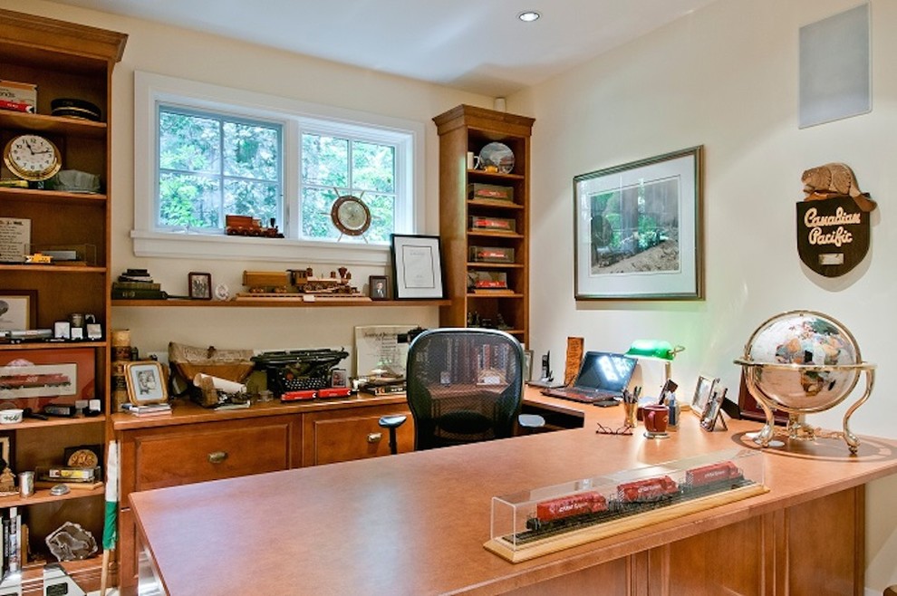 Mid-sized mountain style freestanding desk study room photo in Orange County with beige walls and no fireplace