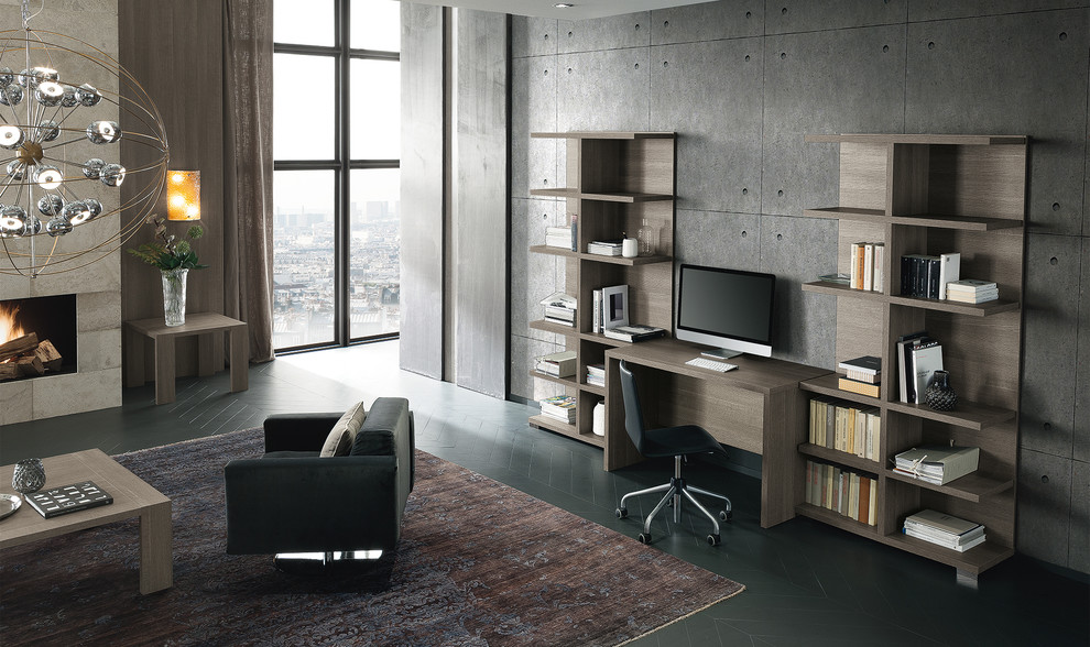 Diseño de despacho contemporáneo grande con paredes grises, suelo de madera pintada, todas las chimeneas, marco de chimenea de piedra, escritorio independiente y suelo gris