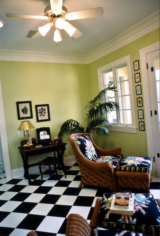 Example of a mid-sized classic freestanding desk ceramic tile and black floor home office design in Los Angeles with yellow walls