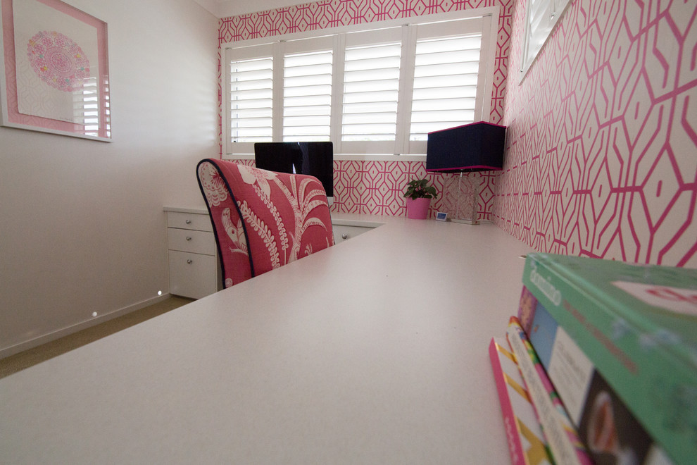 Inspiration for a medium sized beach style study in Brisbane with pink walls, carpet and a built-in desk.