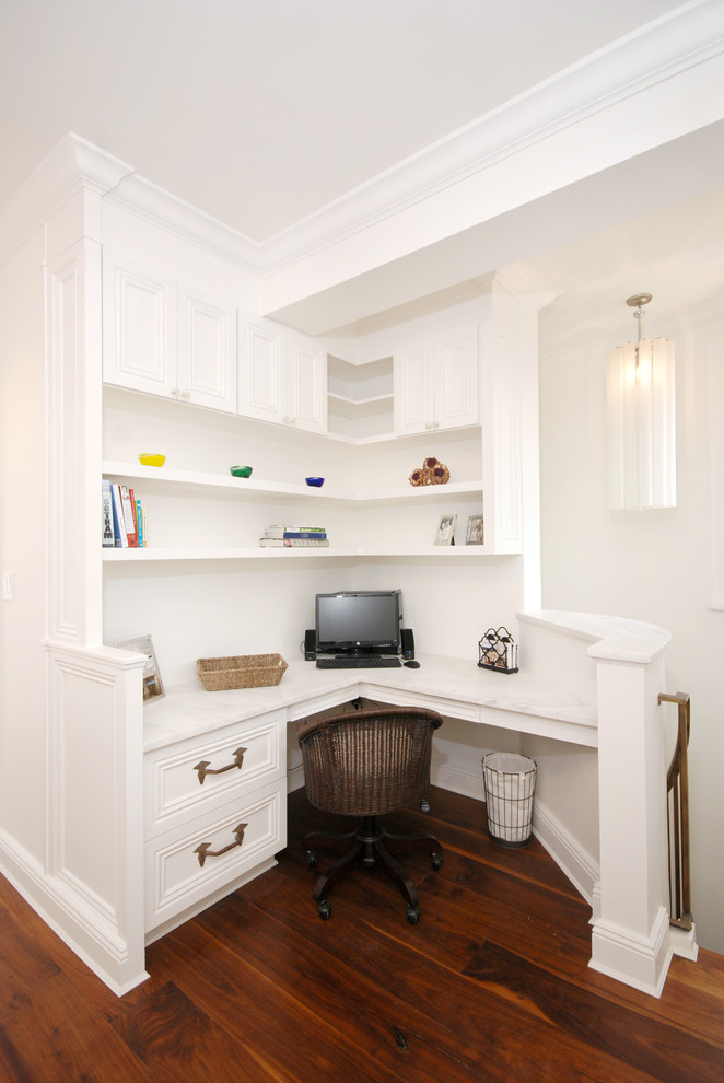 Home office - traditional built-in desk home office idea in New York