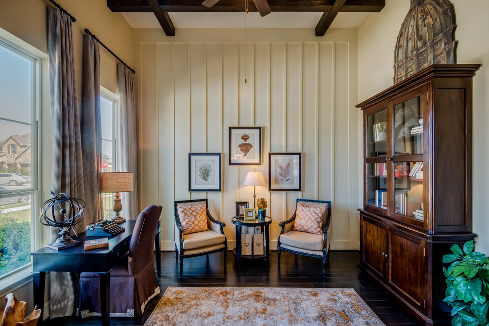Elegant freestanding desk dark wood floor home studio photo in Houston with beige walls