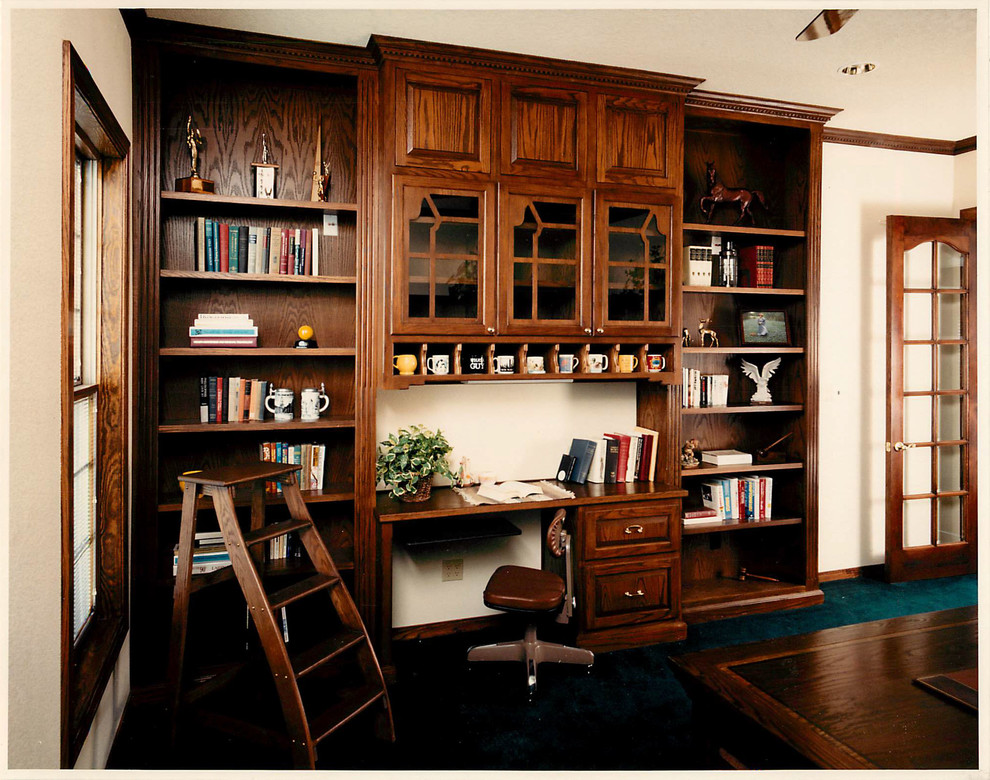 Design ideas for a large traditional home office in Albuquerque with beige walls, carpet and a built-in desk.