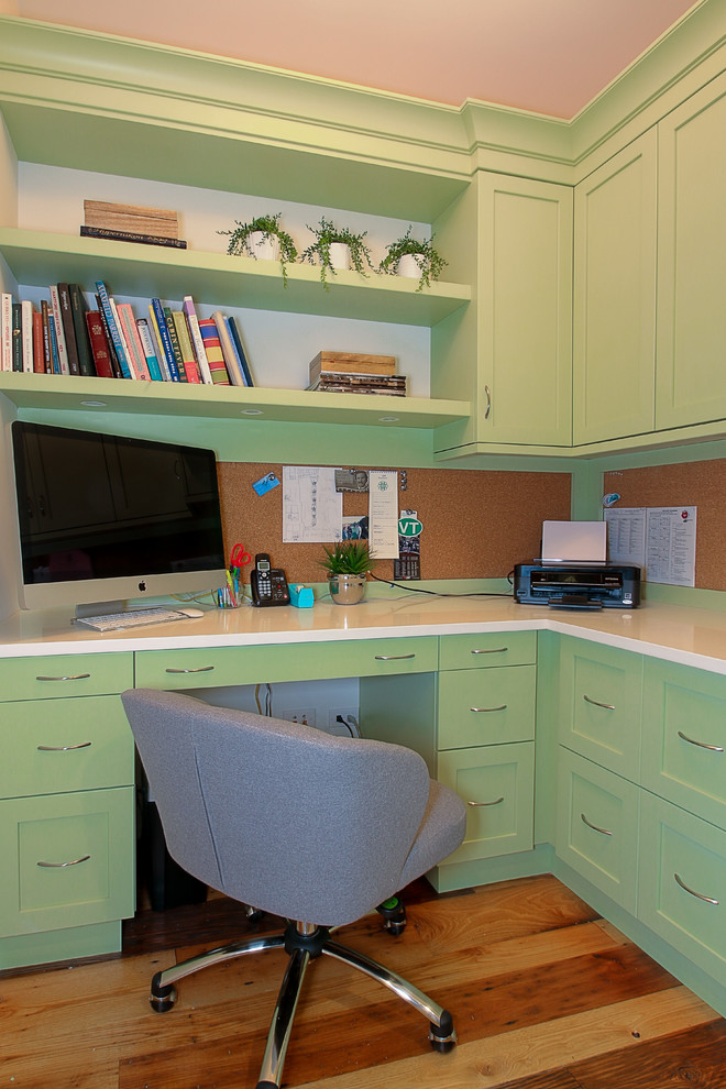 Mid-sized transitional built-in desk medium tone wood floor study room photo in Chicago with no fireplace and beige walls