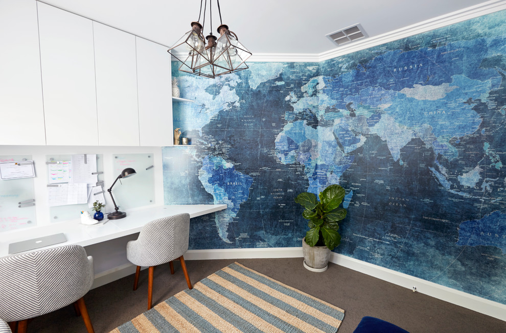 Inspiration for a mid-sized contemporary built-in desk carpeted study room remodel in Sydney with white walls