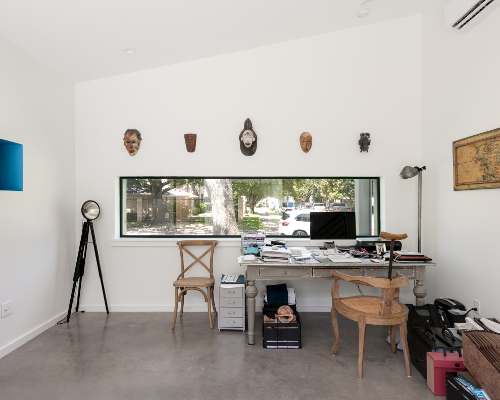 This is an example of a small modern home office in Houston.