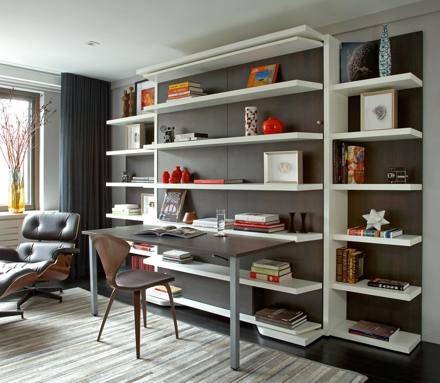 Medium sized retro study in New York with grey walls, dark hardwood flooring and a built-in desk.