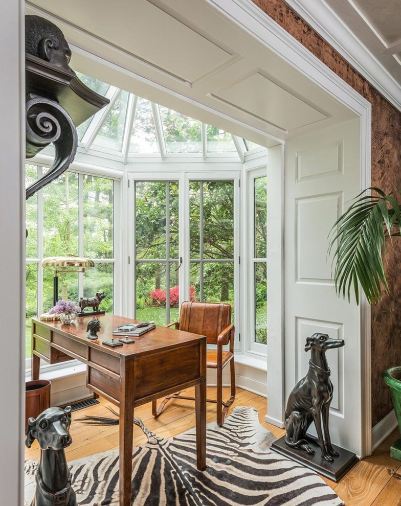 Cottage freestanding desk medium tone wood floor and brown floor study room photo in Other with white walls
