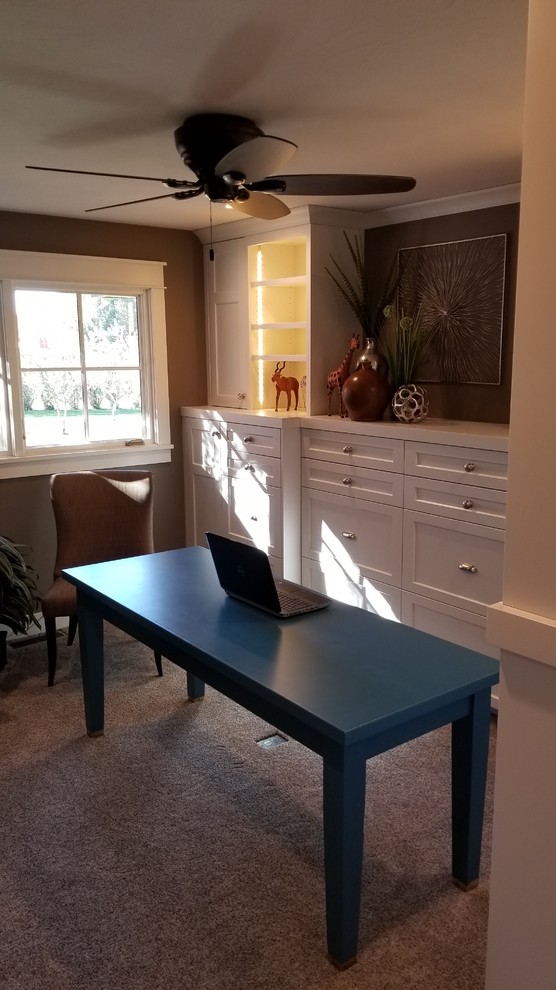 Study room - mid-sized contemporary freestanding desk carpeted and beige floor study room idea in Omaha with beige walls and no fireplace