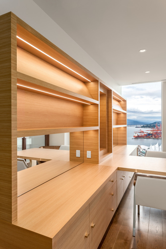 This is an example of an expansive contemporary home office in Vancouver.