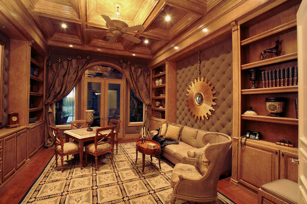 Home office - large traditional medium tone wood floor and brown floor home office idea in Las Vegas with no fireplace