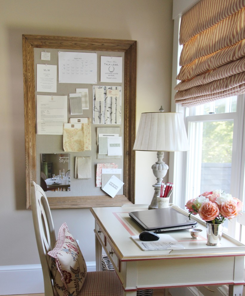 Photo of a small classic study in Burlington with beige walls, light hardwood flooring and a freestanding desk.