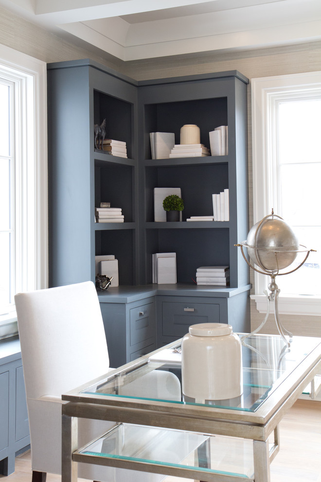 Large farmhouse freestanding desk light wood floor study room photo in New York with beige walls and no fireplace