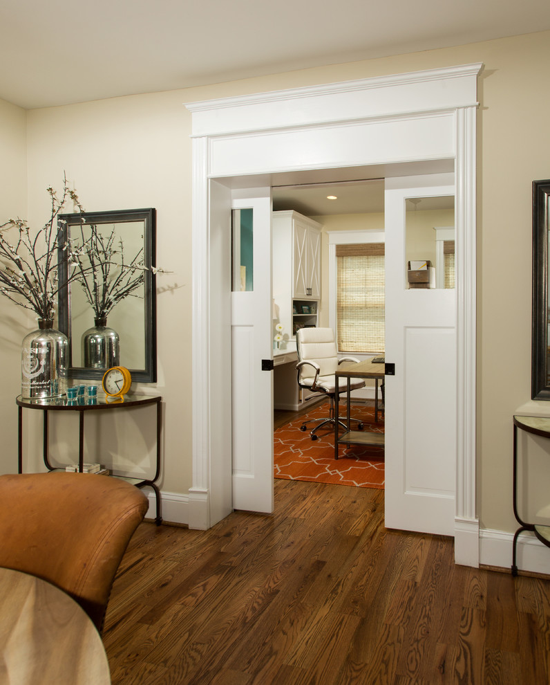 Inspiration for a victorian built-in desk medium tone wood floor study room remodel in DC Metro with beige walls