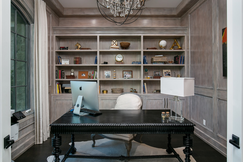 Inspiration for a transitional freestanding desk dark wood floor, brown floor and wall paneling study room remodel in Los Angeles