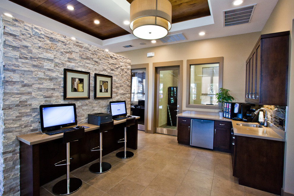 Example of a mid-sized trendy built-in desk ceramic tile home office design in Las Vegas with beige walls