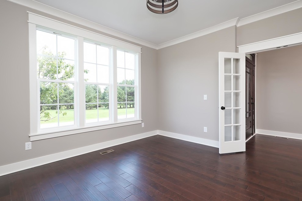 Design ideas for a medium sized traditional study in Raleigh with grey walls, brown floors, vinyl flooring and no fireplace.