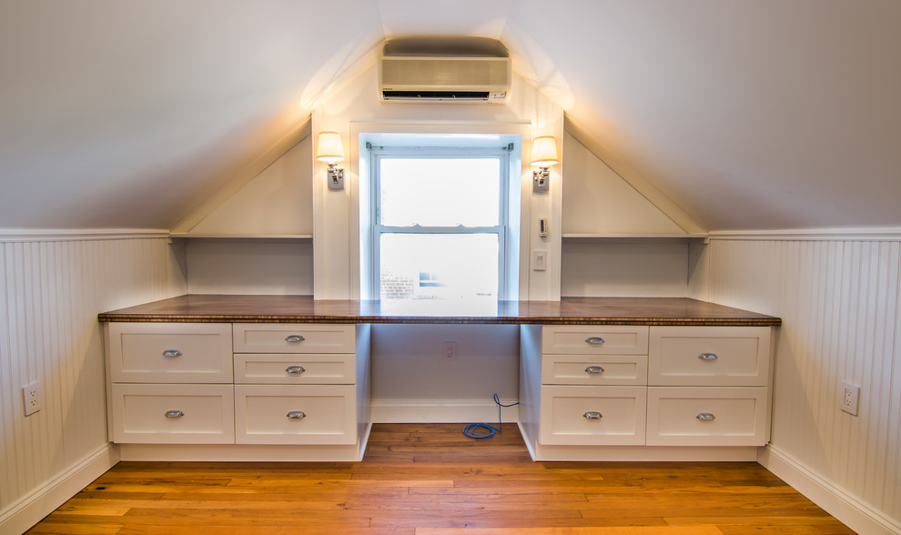 Study room - craftsman built-in desk study room idea in DC Metro with white walls and no fireplace