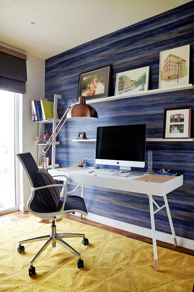 Small minimalist freestanding desk dark wood floor study room photo in London with blue walls and no fireplace