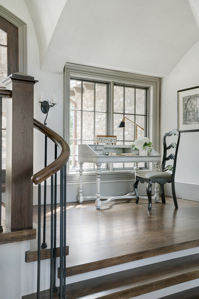 Inspiration for a timeless freestanding desk medium tone wood floor and brown floor home office remodel in Other with white walls
