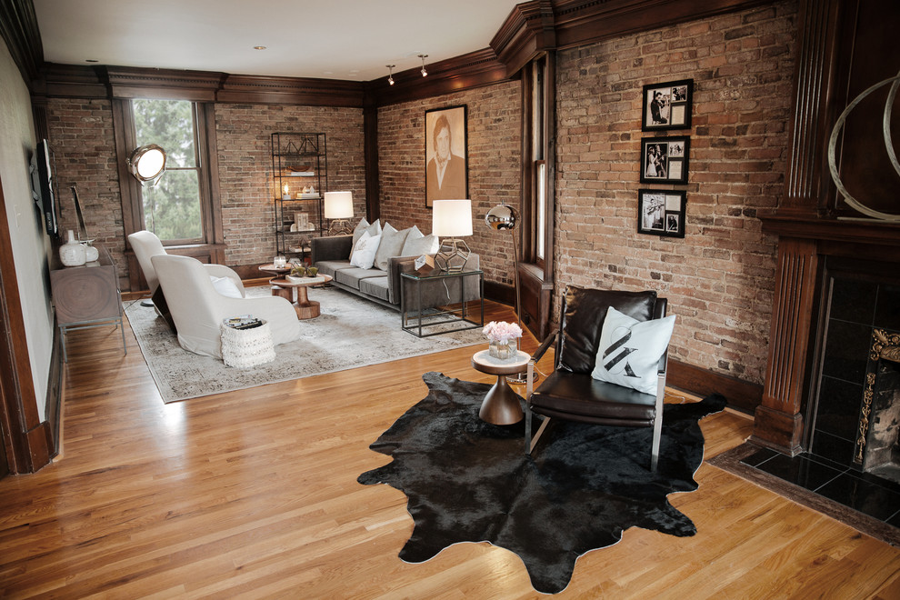 Large eclectic freestanding desk medium tone wood floor home studio photo in Nashville with a standard fireplace and a stone fireplace