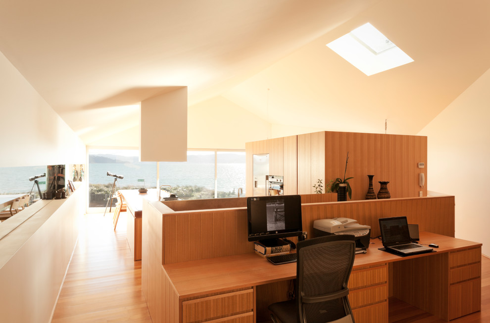 Design ideas for a medium sized modern home office in Auckland.