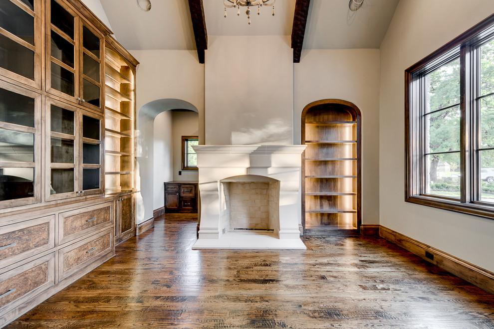 Mid-sized transitional dark wood floor study room photo in Dallas with a stone fireplace, beige walls and a standard fireplace