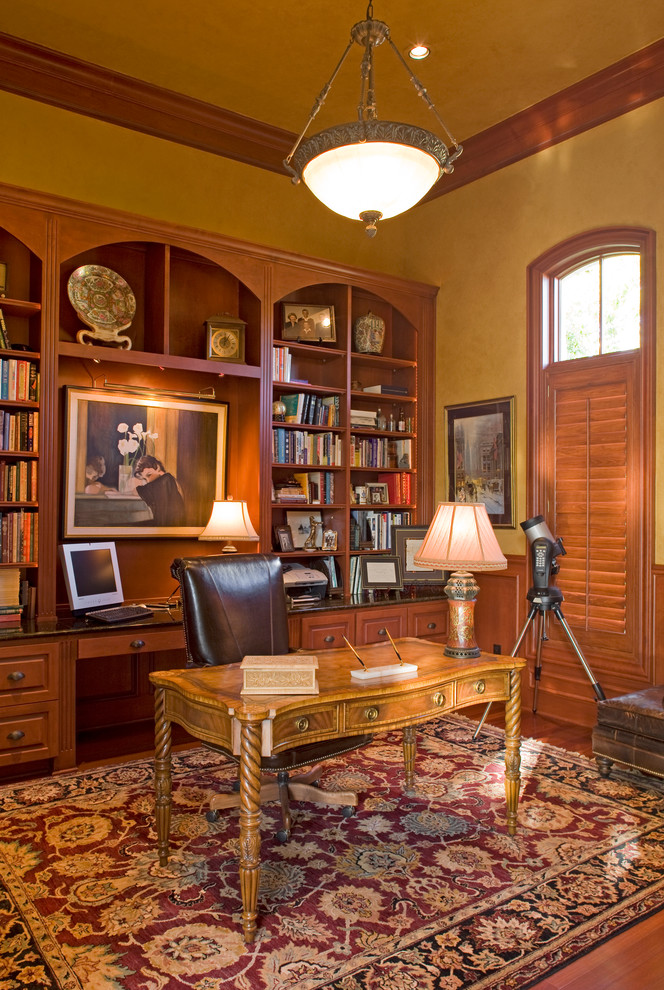 Photo of a classic home office in Austin with a built-in desk.