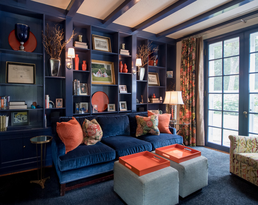 На фото: домашняя библиотека среднего размера в стиле неоклассика (современная классика) с синими стенами, ковровым покрытием, стандартным камином, фасадом камина из кирпича и синим полом