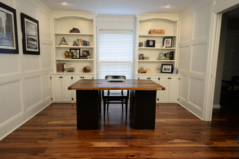 Inspiration for a mid-sized transitional freestanding desk dark wood floor study room remodel in Kansas City with white walls