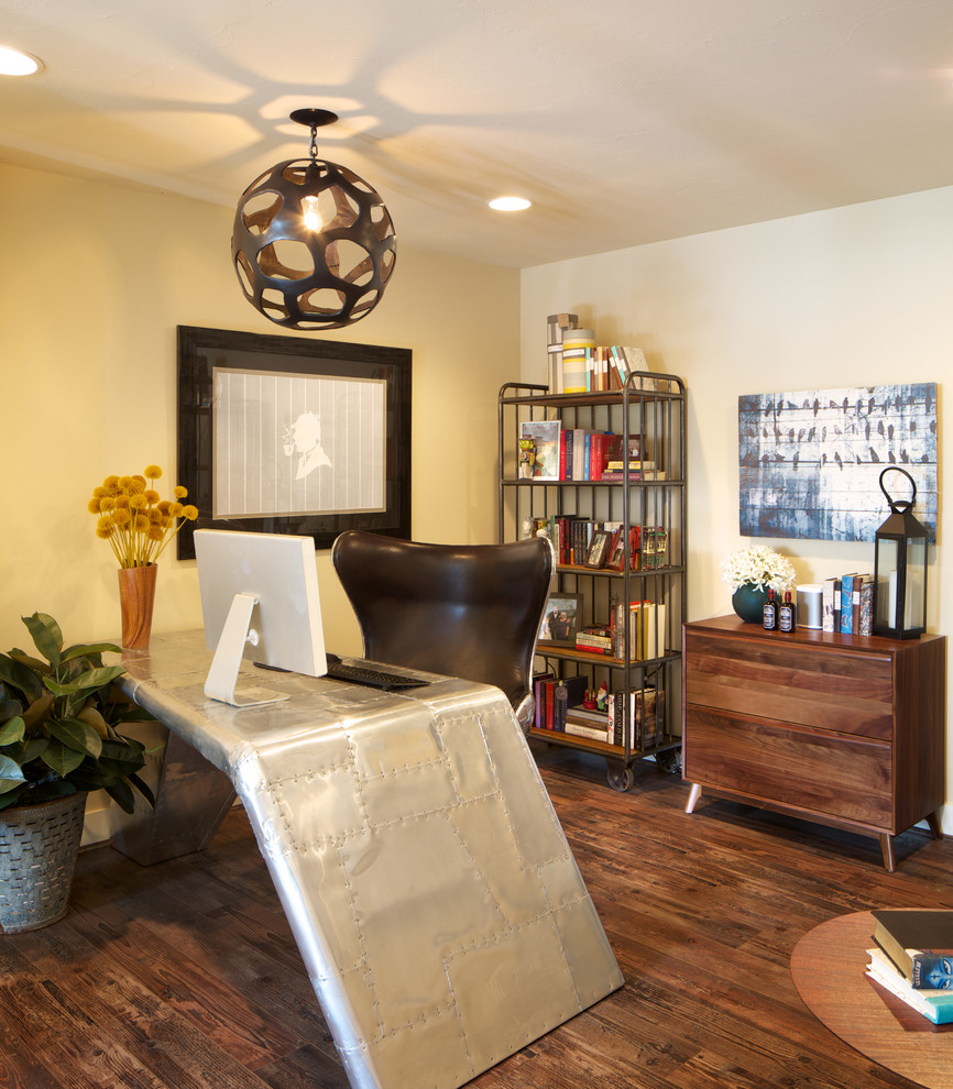 Transitional freestanding desk dark wood floor home office photo in Denver with beige walls