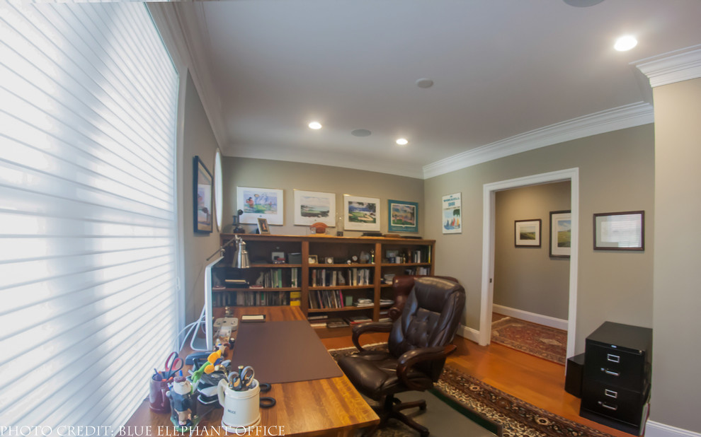 Inspiration for a large transitional freestanding desk dark wood floor home office remodel in Other with beige walls