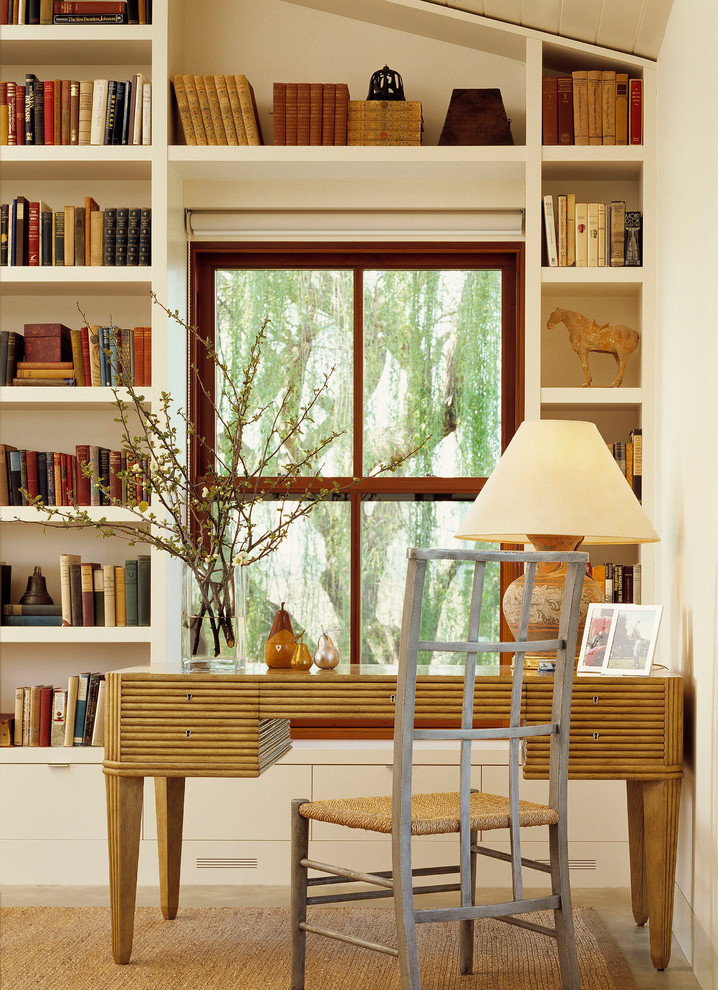 Inspiration for a transitional freestanding desk home office remodel in Sacramento with white walls