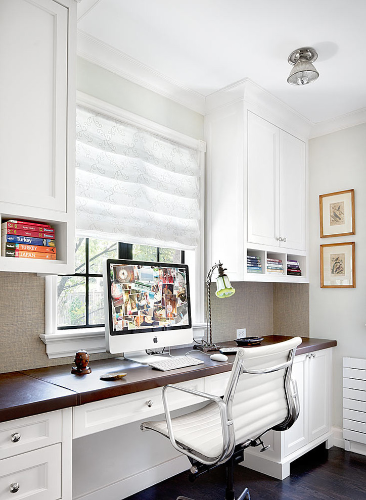 Elegant built-in desk home office photo in Chicago